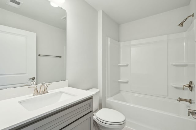 full bath featuring washtub / shower combination, visible vents, vanity, and toilet