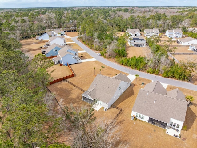 bird's eye view with a residential view and a view of trees