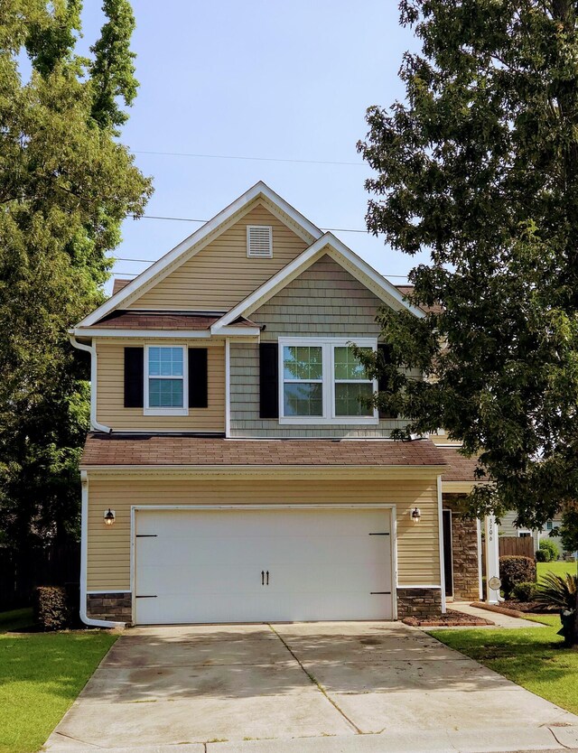 3706 Blackjack Rd, Ladson, SC 29456 - craftsman house featuring a garage, driveway, and stone siding