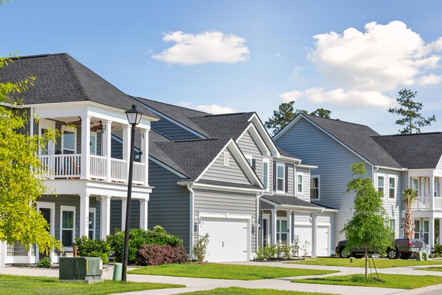798 Clay Field Trl, Summerville, SC 29485 - view of front of home with a garage, a balcony, a front yard, and a shingled roof