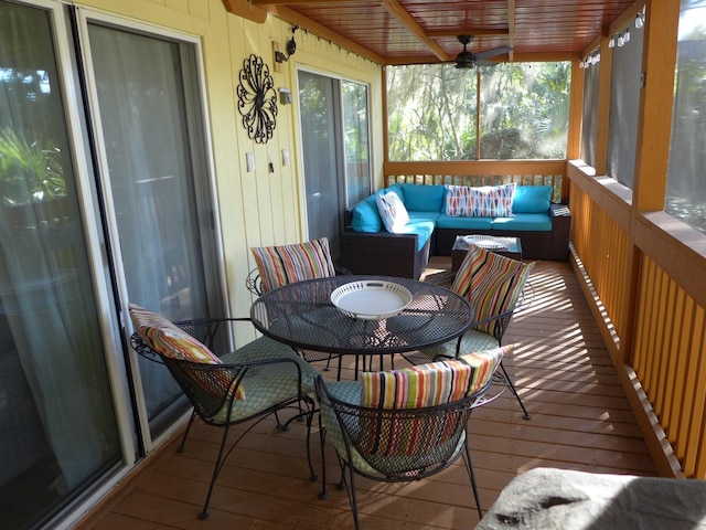 sunroom / solarium with ceiling fan and wooden ceiling