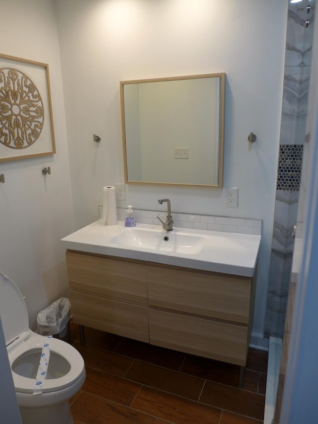 bathroom with toilet and vanity