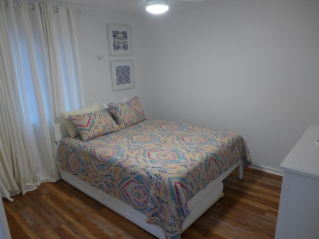 bedroom featuring dark wood-type flooring