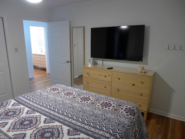 bedroom featuring dark wood-type flooring and ornamental molding