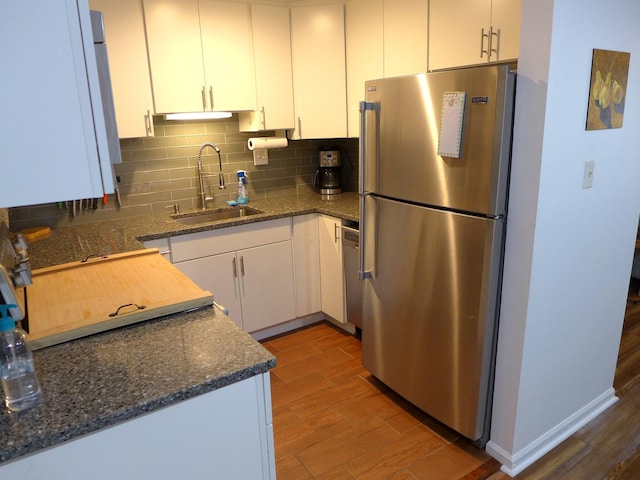 kitchen featuring white cabinets, appliances with stainless steel finishes, and sink