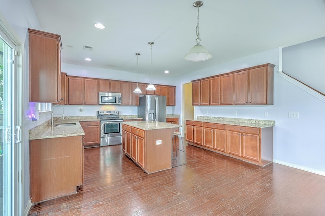 531 Crossland Dr, Moncks Corner, SC 29461 - kitchen featuring stainless steel appliances, a sink, light stone countertops, dark wood finished floors, and recessed lighting