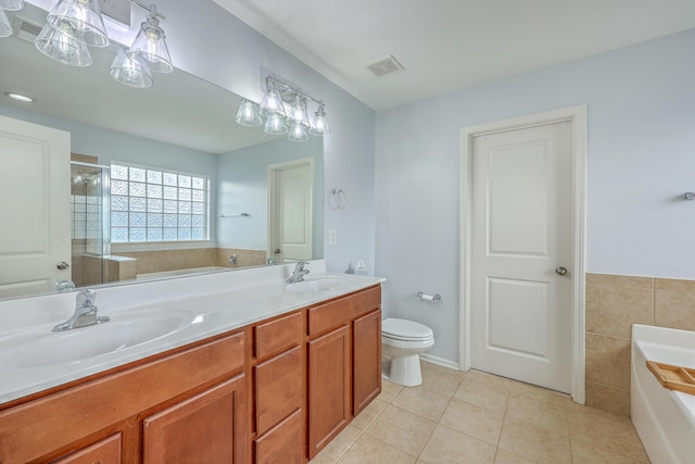 531 Crossland Dr, Moncks Corner, SC 29461 - bathroom with a bath, tile patterned floors, double vanity, a shower with shower door, and toilet
