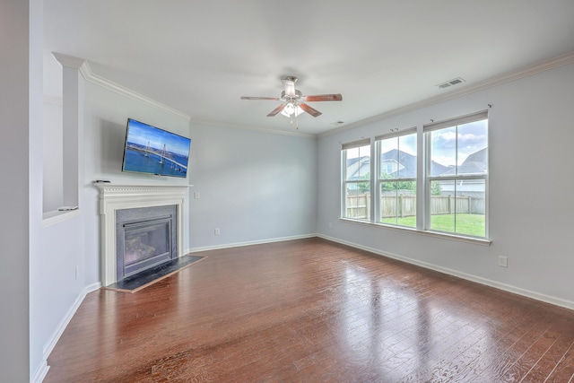 531 Crossland Dr, Moncks Corner, SC 29461 - unfurnished living room featuring a ceiling fan, baseboards, a glass covered fireplace, hardwood / wood-style flooring, and crown molding