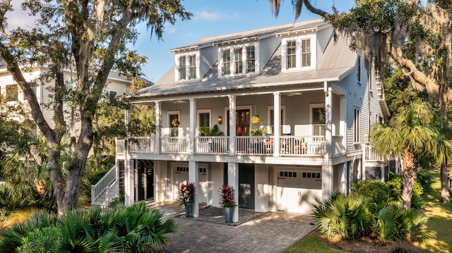 view of front of home with a garage and a porch