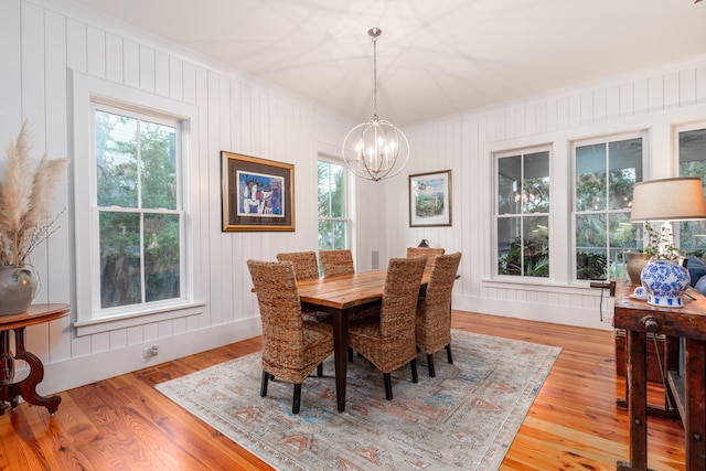 dining area featuring a chandelier and light hardwood / wood-style flooring