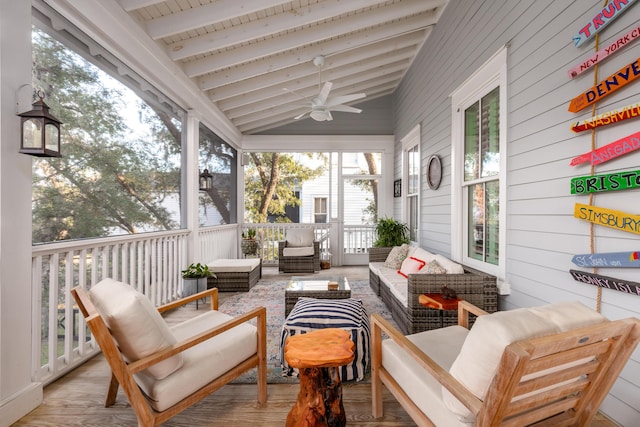 sunroom / solarium with vaulted ceiling with beams and wooden ceiling