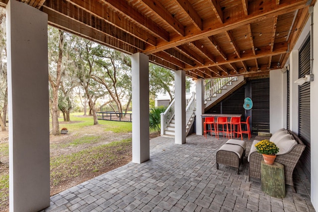 view of patio with an outdoor bar