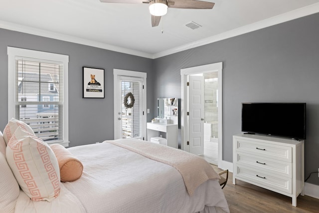 bedroom with ornamental molding, multiple windows, dark wood finished floors, and visible vents