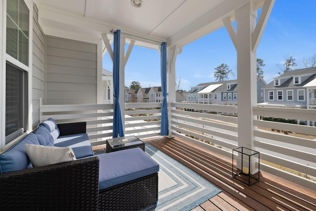 wooden deck with a residential view