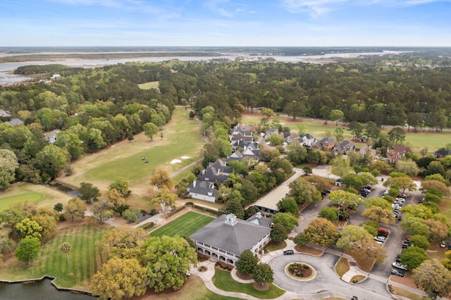 bird's eye view featuring a view of trees and golf course view