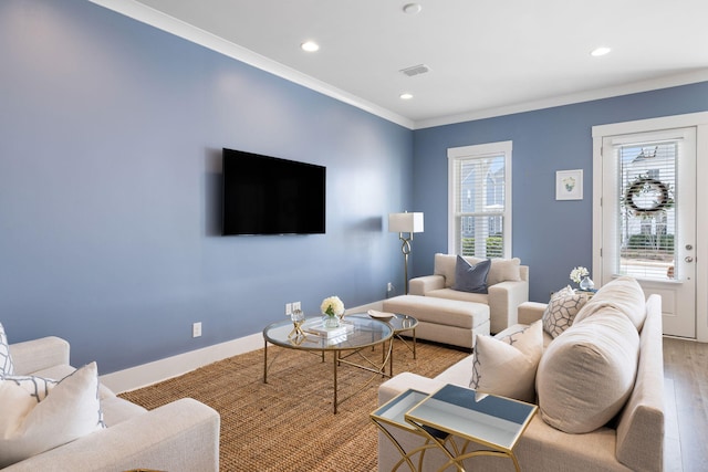 living room with crown molding, recessed lighting, visible vents, wood finished floors, and baseboards