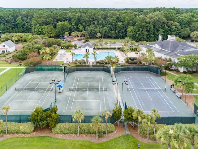 drone / aerial view featuring a wooded view