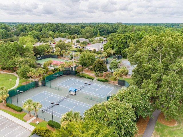 drone / aerial view featuring a view of trees