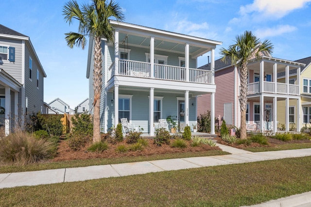 view of front of home featuring a balcony