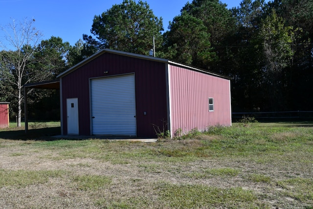 view of outbuilding with a garage