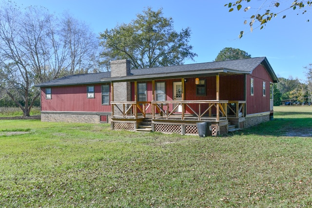 back of house with a yard