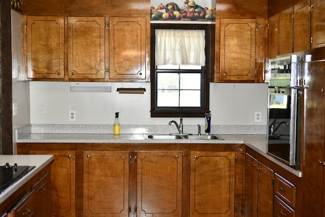 kitchen with black electric cooktop and sink