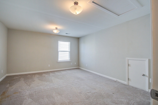 empty room with light colored carpet