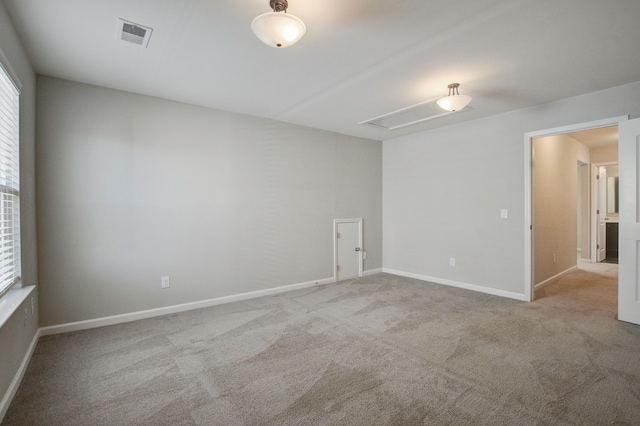 unfurnished room with light colored carpet