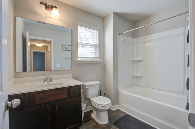 full bathroom featuring shower / bathing tub combination, hardwood / wood-style floors, vanity, and toilet