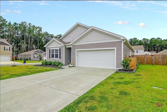 view of front of home with a garage and a front lawn