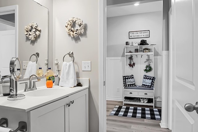 bathroom with vanity and hardwood / wood-style flooring