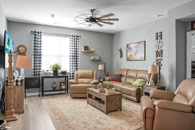 living room with hardwood / wood-style flooring and ceiling fan