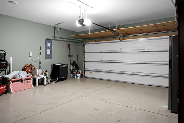 garage featuring a garage door opener and electric panel