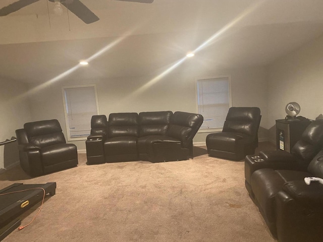 home theater featuring vaulted ceiling, a ceiling fan, and carpet floors