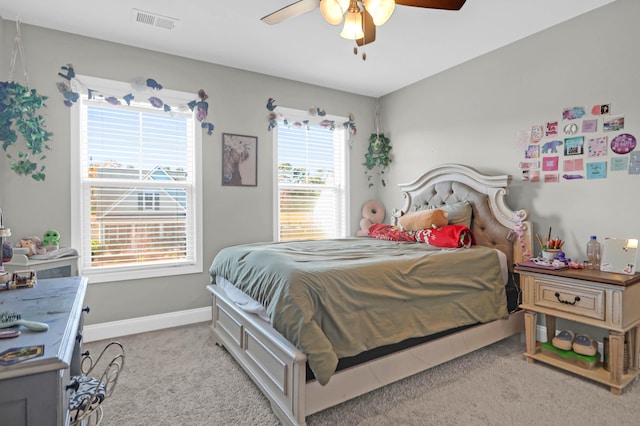 bedroom featuring ceiling fan and light colored carpet