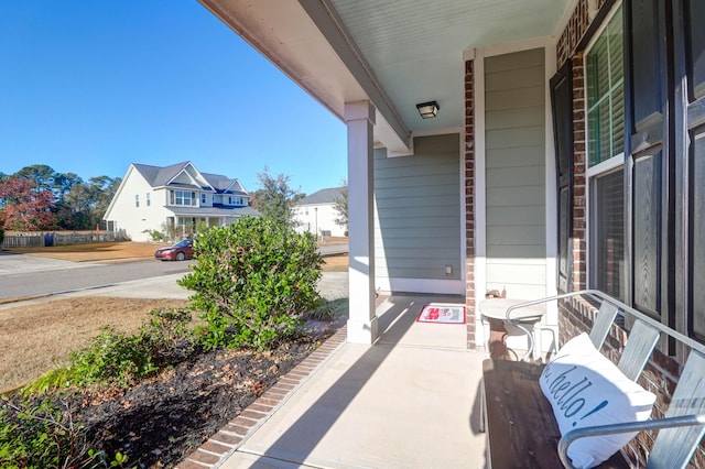 view of patio featuring a porch