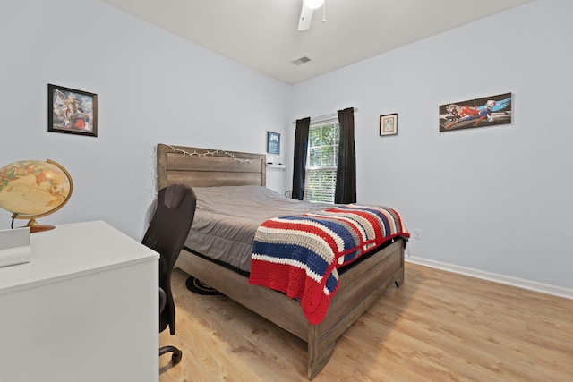 bedroom with ceiling fan and light wood-type flooring