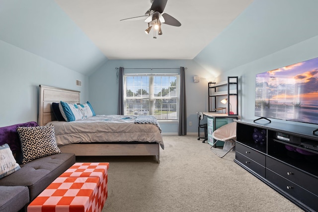 bedroom with ceiling fan, carpet floors, and vaulted ceiling