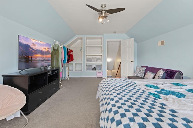 carpeted bedroom with ceiling fan and lofted ceiling