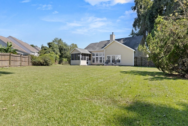 view of yard with a sunroom