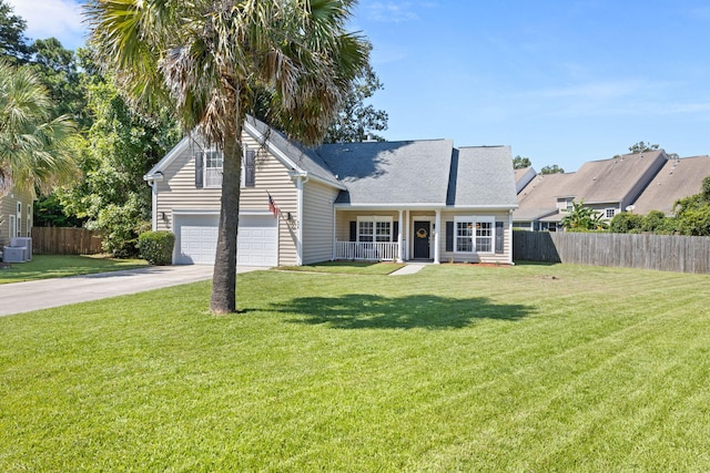 view of front facade with a front yard and a garage