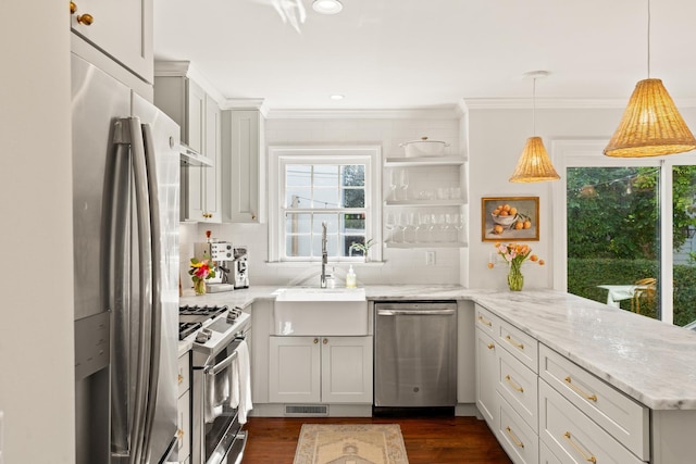 5 Smith St, Charleston, SC 29401 - kitchen featuring stainless steel appliances, a peninsula, crown molding, decorative backsplash, and dark wood-style floors