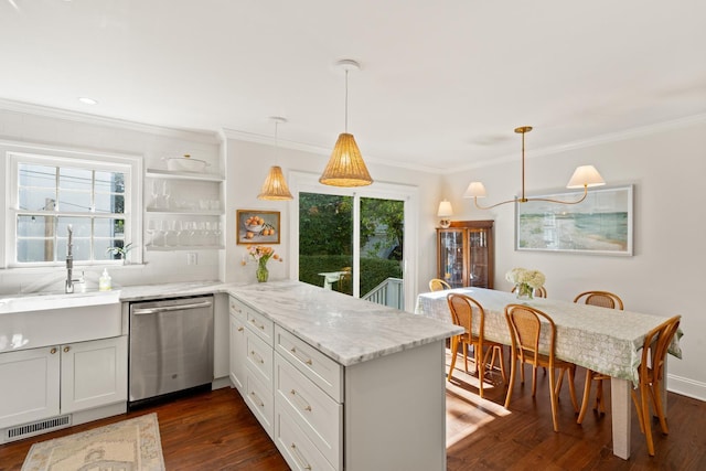 5 Smith St, Charleston, SC 29401 - kitchen with stainless steel dishwasher, a peninsula, crown molding, dark wood-style flooring, and light stone counters