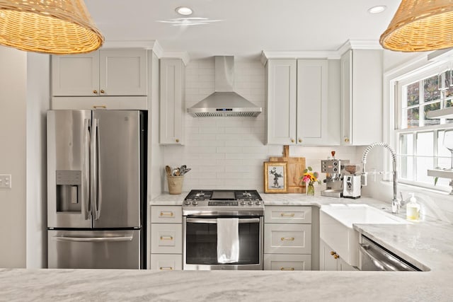 5 Smith St, Charleston, SC 29401 - kitchen featuring stainless steel appliances, wall chimney exhaust hood, a sink, backsplash, and light stone counters