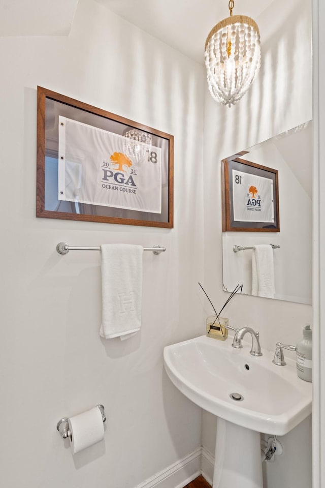 5 Smith St, Charleston, SC 29401 - bathroom with a chandelier and a sink