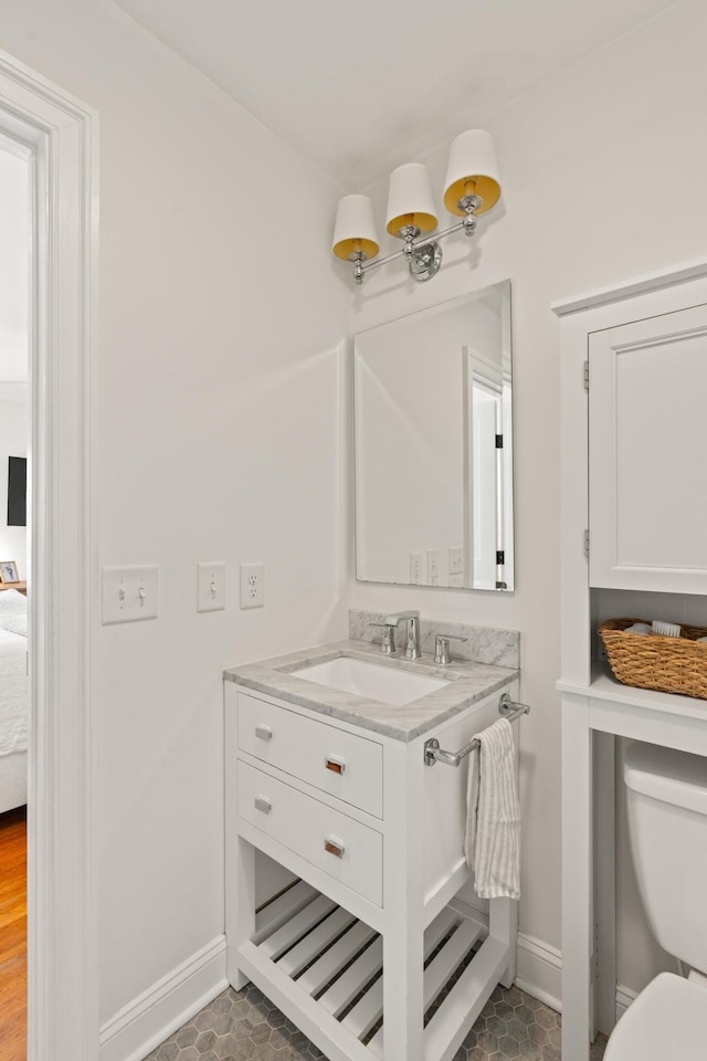 5 Smith St, Charleston, SC 29401 - bathroom featuring baseboards, toilet, vanity, and ensuite bath