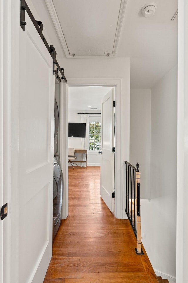 5 Smith St, Charleston, SC 29401 - corridor with stacked washer / drying machine, an upstairs landing, light wood-type flooring, and attic access