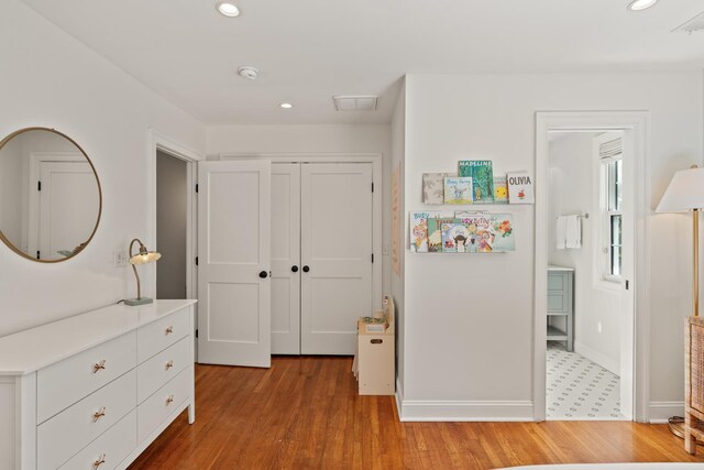5 Smith St, Charleston, SC 29401 - bedroom with recessed lighting, light wood-style floors, baseboards, and a closet