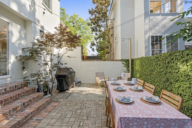 5 Smith St, Charleston, SC 29401 - view of patio with outdoor dining space, area for grilling, and fence