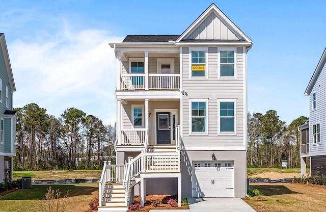 view of front of property with a front lawn, a garage, covered porch, and a balcony